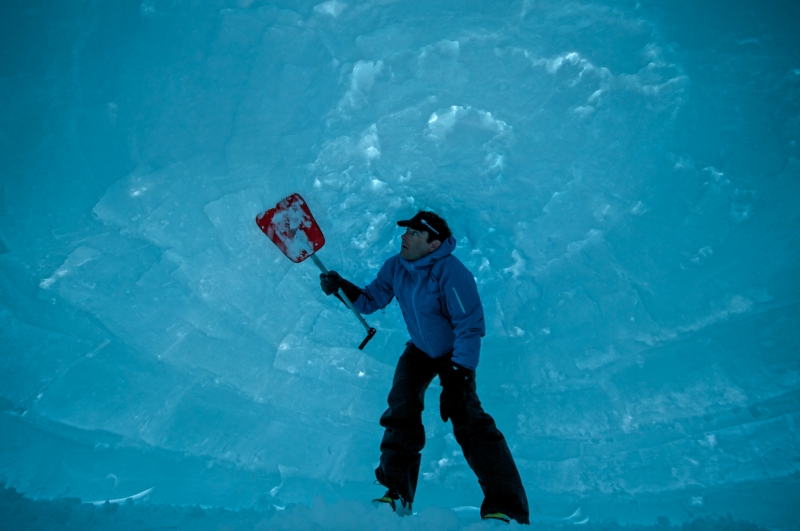 Chris Denny puts the finishing touches on an igloo in the Teton Backcountry, WY.