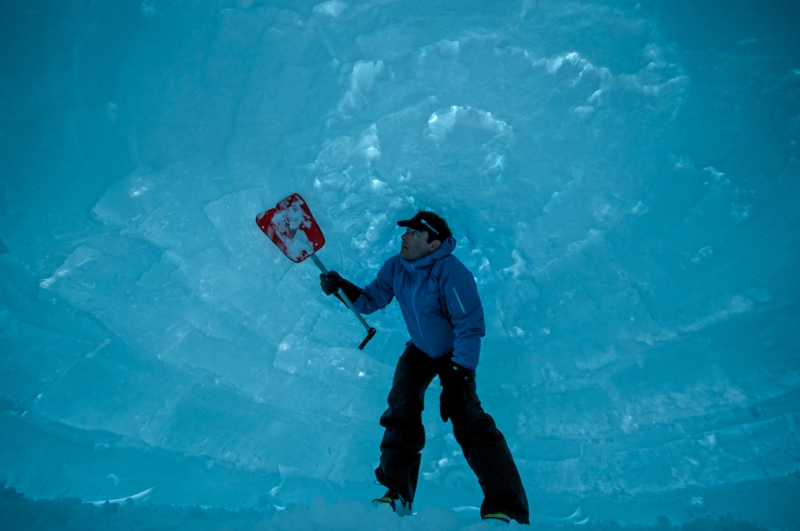 Chris Denny puts the finishing touches on an igloo in the Teton Backcountry, WY.